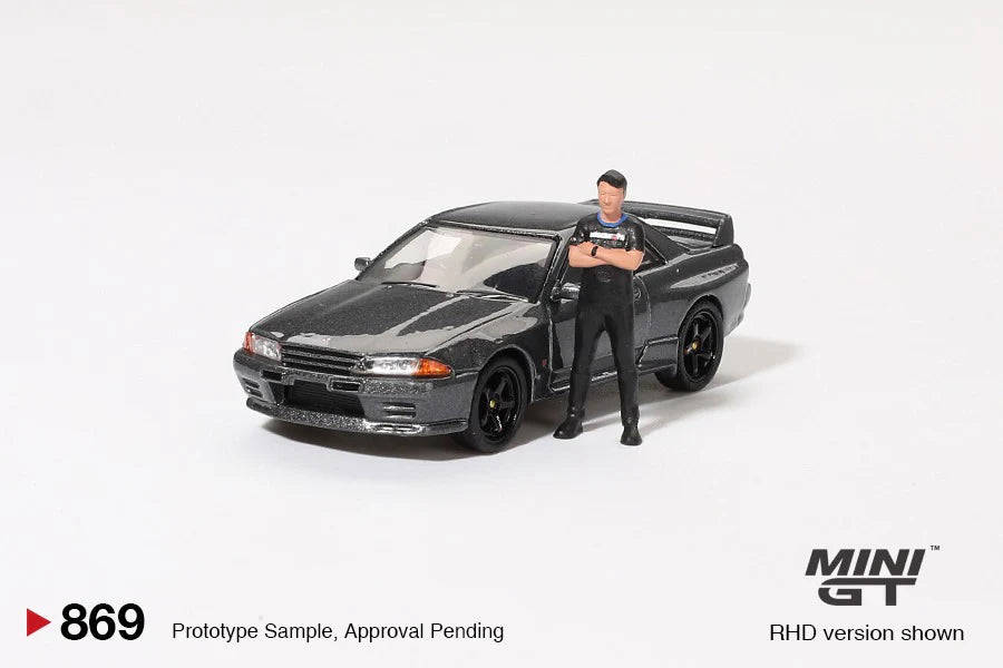 MINI GT 1:64 Nissan Skyline GT-R (R32) Nismo Gunmetal W/ Matsuda Figure Tsugio Matsuda Collection